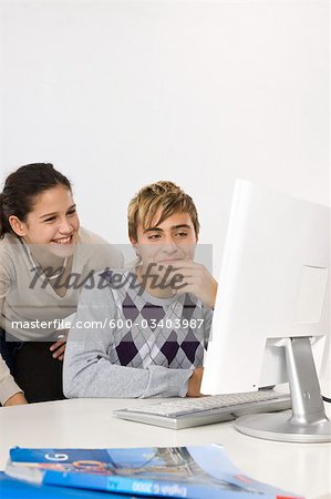 Two Teenagers Using Computer