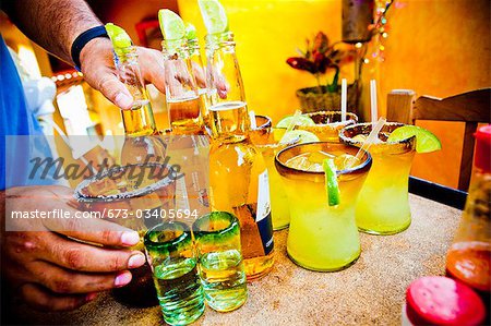 waiter serving drinks in mexico