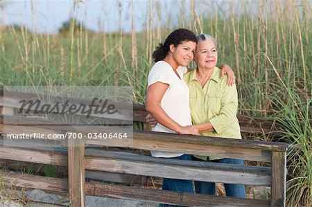 Mother and Daughter Embracing at Beach