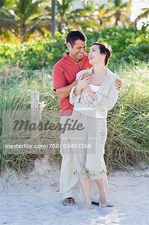 Couple Embracing on Beach