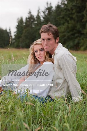 Couple Sitting in Grass, Brush Prairie, Washington, USA