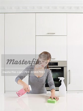 Woman Cleaning Countertop