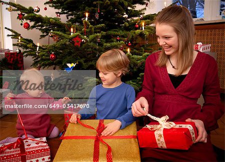 boy,baby,girl with christmas presents