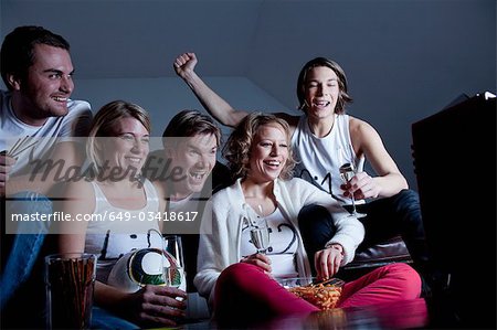 friends watching TV together