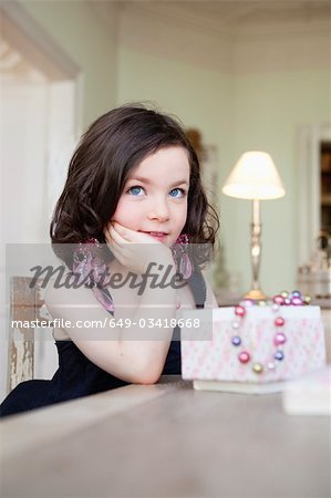 little girl posing with jewelry