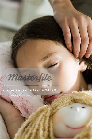 Girl sleeping with doll