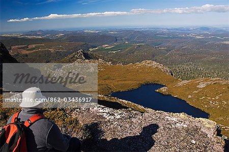 Australia,Tasmania,Black Bluff Mountain. Hiker contemplating the view.