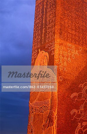 Mongolia,Khentii Province. Sunrise on a carved Obelisk dedicated to Genghis Khan.