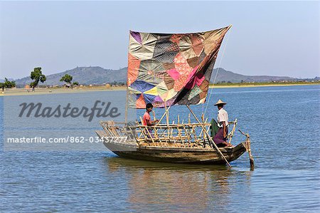 Myanmar,Burma,Kaladan River. A traditional sailing boat on the Kaladan River.