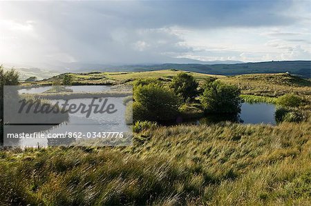 Wales,Conwy,Pentre Foilas. A storm gathering over the Snowdonia mountains viewed from Gilar farm duck ponds.