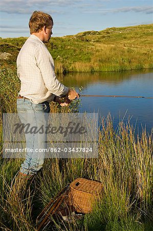 UK,Wales,Conwy. Trout fishing at a hill lake in North Wales