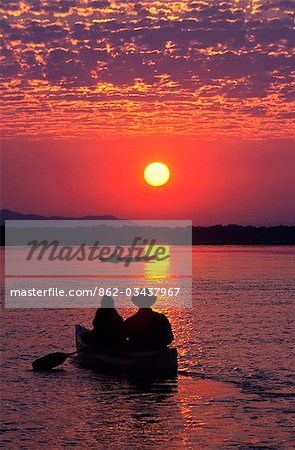 Canoeing at sun rise on the Zambezi River.