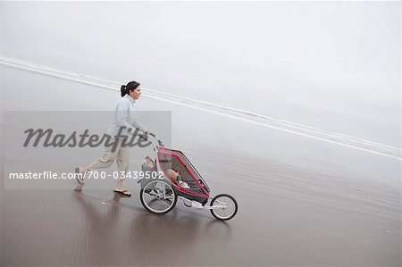 Mother and Daughter Walking on the Beach, Near Seaside, Oregon, USA