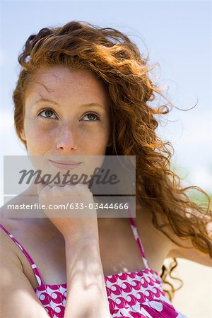 Young woman daydreaming, portrait