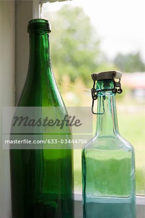 Bottles set in windowsill