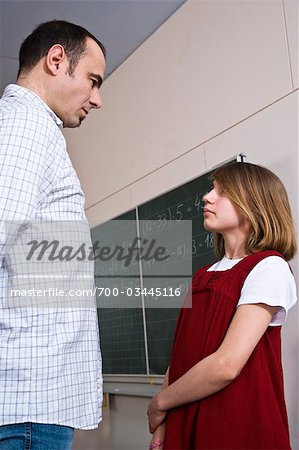 Student and Teacher Facing One Another