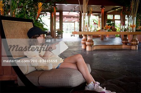 Girl Reading Book in Lobby