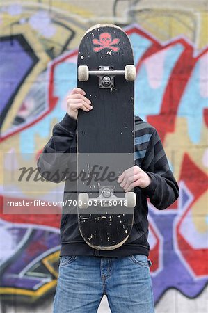 Portrait of Boy With Skateboard