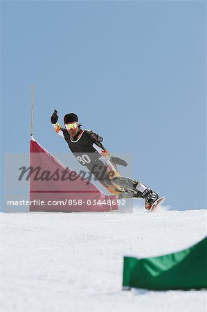 Snowboarder  Riding Snowboard on Snowfield