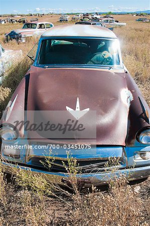 Old, Abandoned Cars in Junk Yard, Desert Southwest, Southwestern United States, USA Old, Abandoned Cars in Junk Yard, Desert Southwest, Southwestern United States, USA
