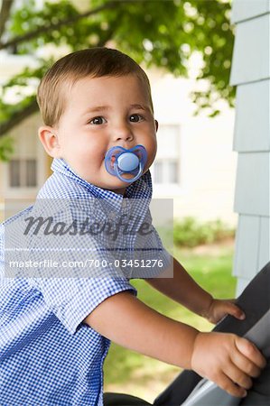Boy with Pacifier in Mouth
