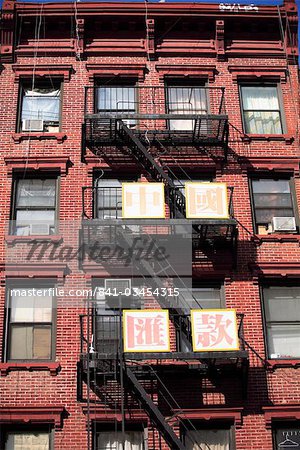 Classic old tenement building with fire escape, Chinatown, Manhattan, New York City, United States of America, North America