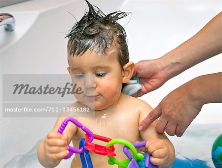 Little Boy Being Washed in Bathtub