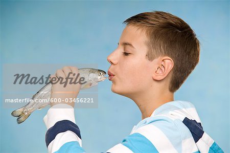 Boy Kissing Fish