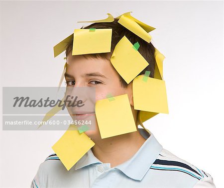 Boy Covered in Sticky Notes