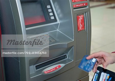 Person Using ATM Machine