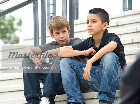 Two Teenage Boys Sitting on Steps