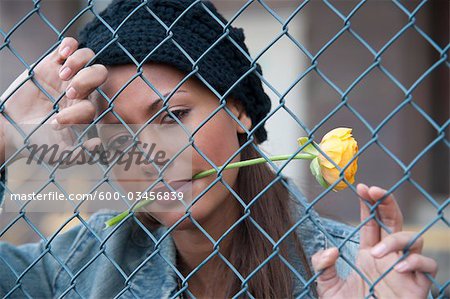 Portrait of Woman behind Fence