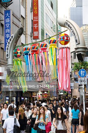 A Shibuya side stree, full of colourful signs and adverts, Tokyo, Japan.