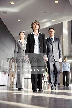 Business people walking towards camera