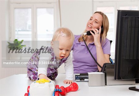 Businesswoman and baby in office