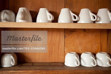 Row of Coffee Cups on Shelf