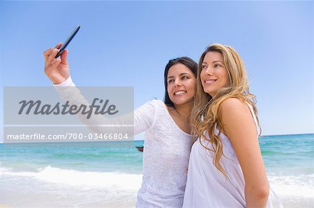 Women Taking Picture with Cellular Telephone