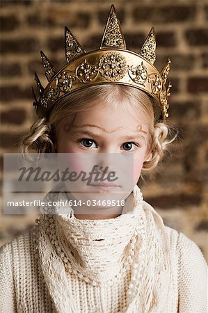 Young girl wearing gold crown