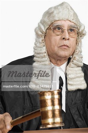 Judge hitting a gavel on the desk