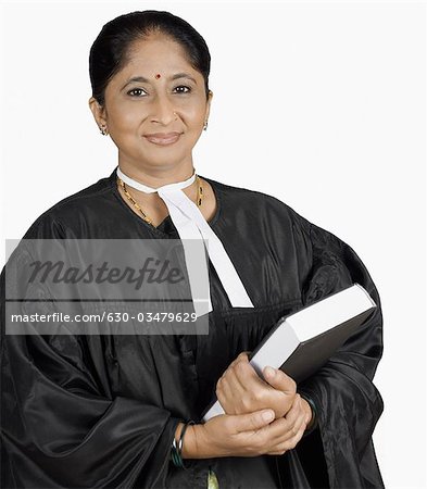 Portrait of a female lawyer holding a book
