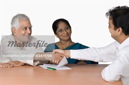 Couple discussing with a financial advisor