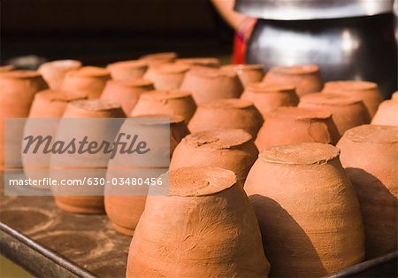 Clay cups in a row at a market stall, Delhi, India