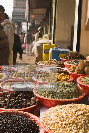 Spices in bowls at a market stall, Delhi, India