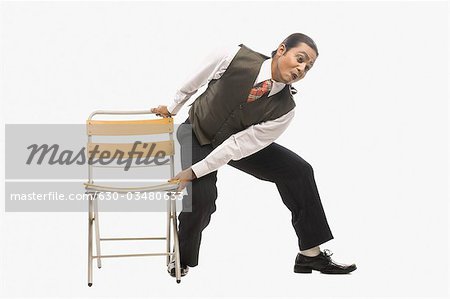 Mime trying to remove a chair