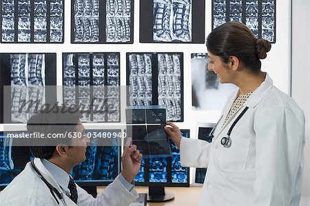 Doctors examining X-Ray report