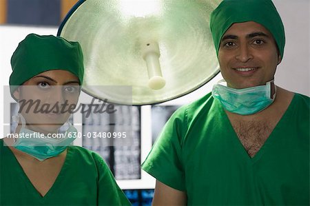 Portrait of two surgeons smiling