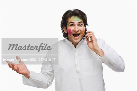 Portrait of a man talking on a mobile phone and smiling