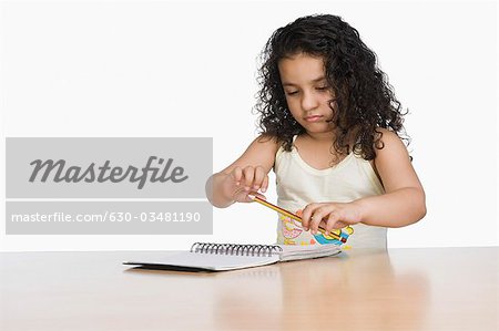 Close-up of a girl holding a pencil