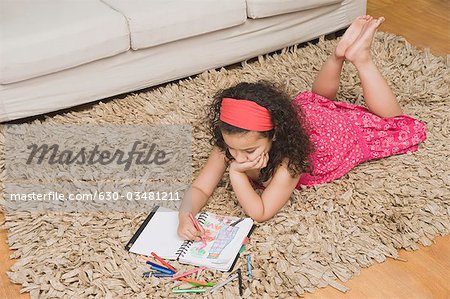 High angle view of a girl drawing a picture