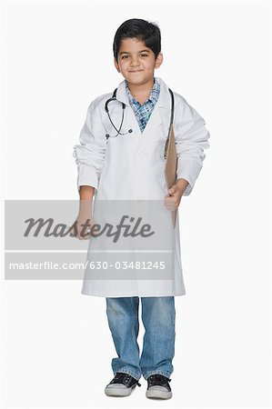 Boy smiling in a lab coat